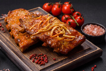 Pork or beef ribs with salt, spices and herbs baked on the grill