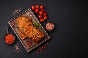 Pork or beef ribs with salt, spices and herbs baked on the grill