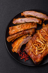 Pork or beef ribs with salt, spices and herbs baked on the grill