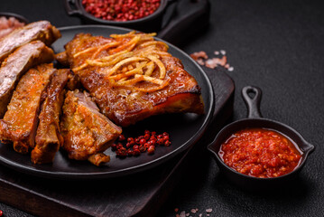 Pork or beef ribs with salt, spices and herbs baked on the grill