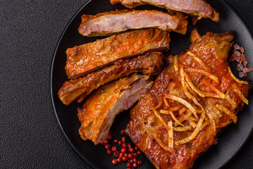 Pork or beef ribs with salt, spices and herbs baked on the grill