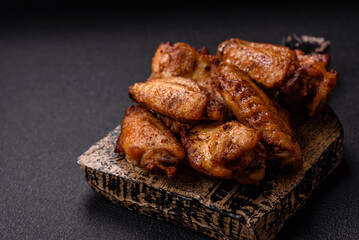 Grilled chicken wings with salt, spices and herbs