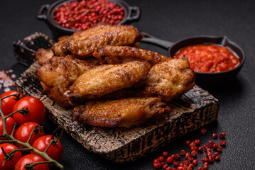 Grilled chicken wings with salt, spices and herbs