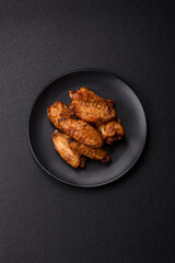 Grilled chicken wings with salt, spices and herbs