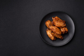 Grilled chicken wings with salt, spices and herbs