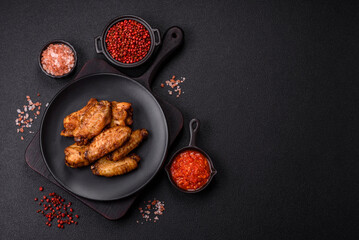 Grilled chicken wings with salt, spices and herbs
