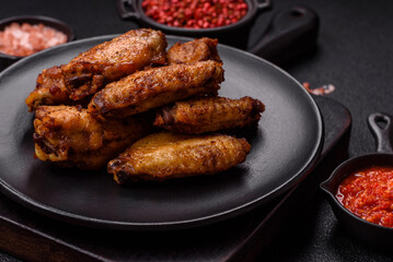 Grilled chicken wings with salt, spices and herbs