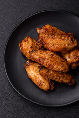 Grilled chicken wings with salt, spices and herbs