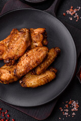 Grilled chicken wings with salt, spices and herbs