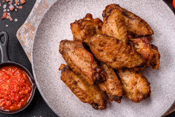 Grilled chicken wings with salt, spices and herbs