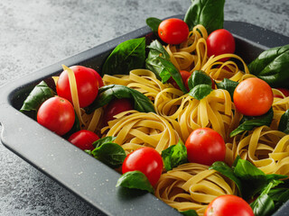 Delicious Fettuccine Pasta with Fresh Tomato Pomodoro Sauce and Parmesan Garnished with Basil