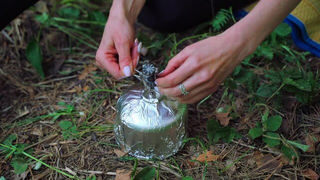 Cooking food and drinks in the forest at a campsite