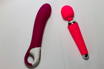 Two erotic Seh Toys of different shape, technology, masturbation device, pink and cherry color...