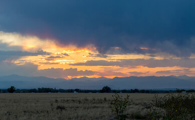 Stormy fall sunset over the prairies and mountains in Aurora, Colorado