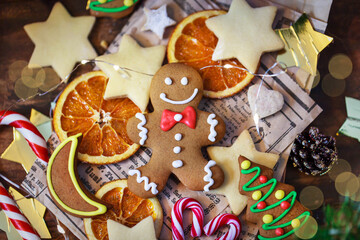 Gingerbread man Christmas cookies on holiday background, top view