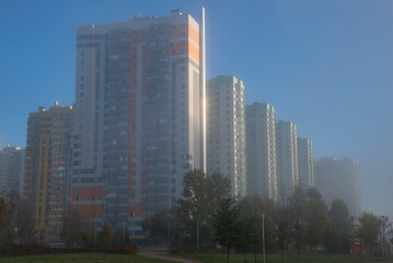 Obraz premium Modern high-rise buildings in the morning autumn fog. Saint Petersburg, Russia
