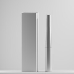 A sleek silver mascara tube and a matching white box stand side-by-side against a clean white background. The minimalist design and clean lines create a modern and elegant aesthetic.