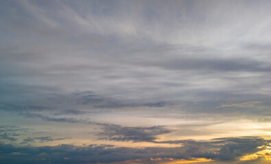 A beautiful sunset sky with soft clouds and warm hues, providing a tranquil backdrop. Perfect for nature lovers and landscape photography.