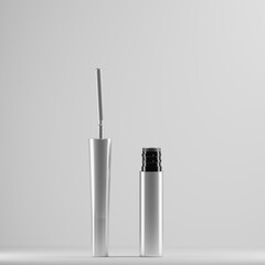 A silver mascara tube with a black cap stands upright next to a matching mascara wand. The minimalist design and clean lines create a sleek and modern aesthetic, perfect for showcasing a high-quality 