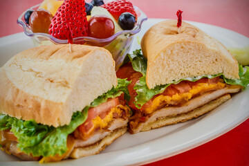 breaded chicken cutlet sandwich with lettuce and tomato