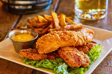 crispy fried fish and chips with french fries © James