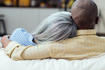 cinematic image of an happy multiethnic senior couple.