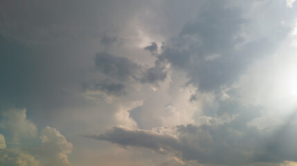 Dramatic clouds swirl in a vibrant sky, creating a stunning natural backdrop. Perfect for weather-related projects or artistic endeavors.