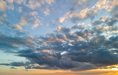 Beautiful cloudscape at sunset, showcasing a vibrant mix of colors and textures in the sky.