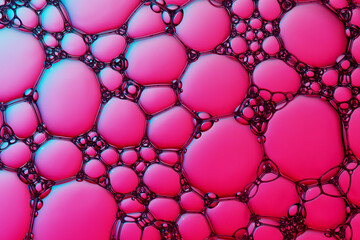 Macro close up of water bubbles with copy space on pink background