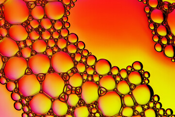 Macro close up of water bubbles with copy space on pink and yellow background