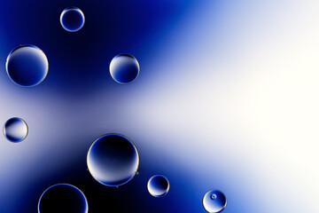 Macro close up of water bubbles with copy space on deep blue background