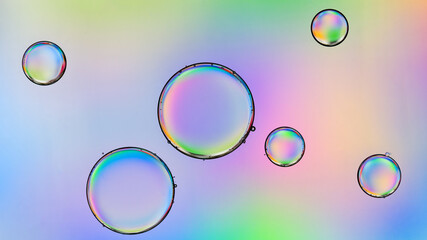 Macro close up of water bubbles with copy space on multicolor background