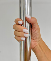 Close up of hand holding a pole