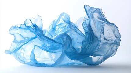 Fototapeta premium Flowing blue fabric against bright background