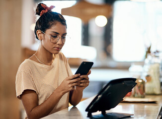 Coffee shop, online order and phone with store owner woman at counter for management of small...
