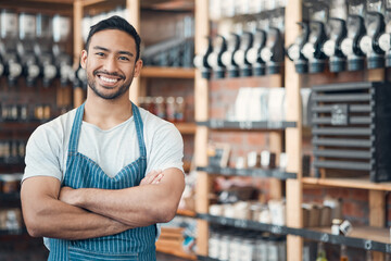 Portrait, small business and asian man with arms crossed for coffee shop, professional and pride for job. Smile, male person and happy barista in cafe for hospitality, customer service and confidence