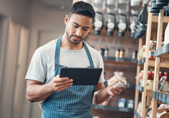 Man, waiter and coffee shop with tablet, inventory and quality control for small business or bistro. Male person, technology and stock management as barista, entrepreneur and employee in restaurant