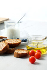 Greek yogurt with slices of toasted whole wheat bread and olive oil
