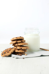 Glass of milk with chocolate chip cookies