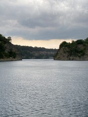 Calm Lake Surrounded by Rocky Cliffs