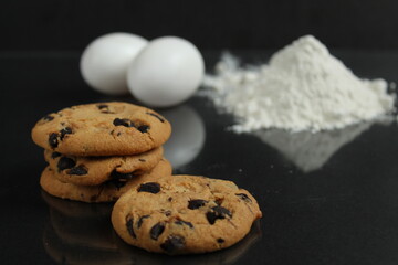 Biscuits Flour Cooking. Ingredients for making biscuits: flour and chicken eggs on the background