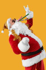 Cool Santa Claus with party blowers showing 