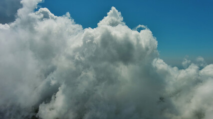 Flying through white fluffy clouds
