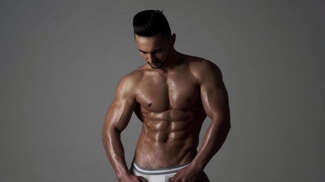 Topless man with muscle. Sexy male body. Handsome sexy model. Shirtless muscled male model. Man with a naked torso. Muscular young man with perfect body stripping. Sexy man. Seductive guy.