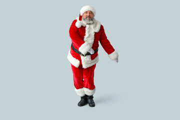 Dancing Santa Claus on grey background
