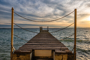 Dock on Lake Garda at sunset