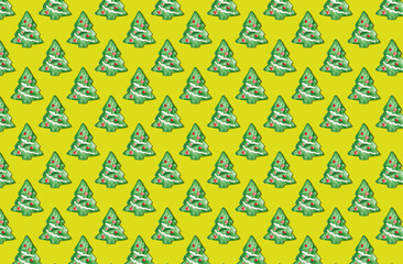 Pattern of christmas tree cookies on yellow pastel background