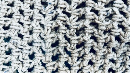 gray wool thread crochet texture . gray background close up