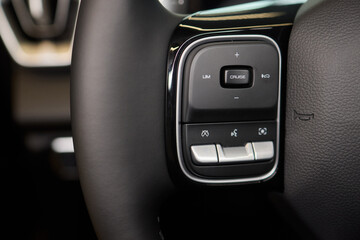 Obraz premium The modern cars steering wheel control panel boosts convenience and performance