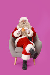Santa Claus with tasty burger on purple background